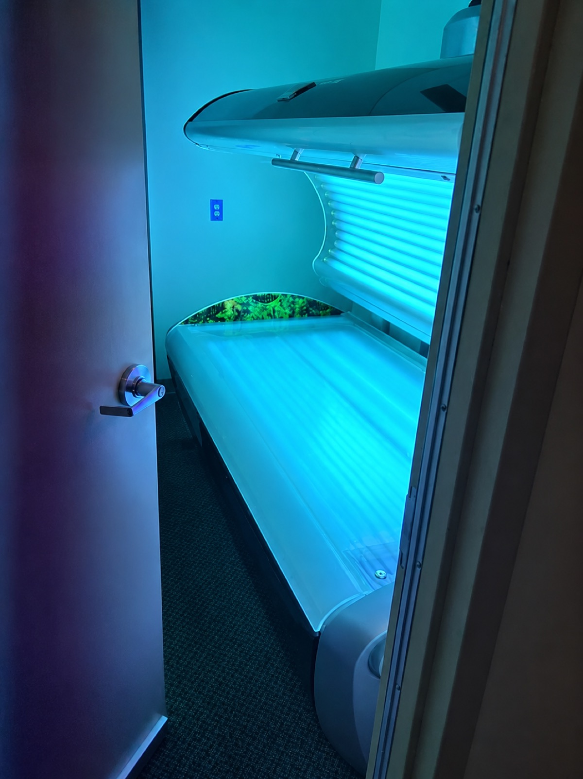 Tanning bed image used in the tanning service header